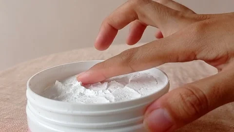 Using baby powder on a hand Stock Footage 146248776