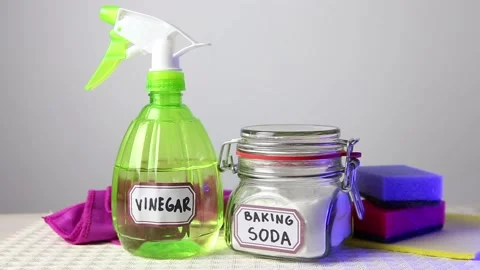 Using baking soda Sodium bicarbonate and white vinegar for home cleaning. Stock-Footage 147860686