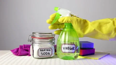 Using baking soda Sodium bicarbonate and white vinegar for home cleaning. Video stock 147860742