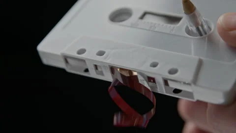 Using a Ballpoint Pen to Wind Slack Magnetic Tape Back Into an Audio Cassette Видео 290046473