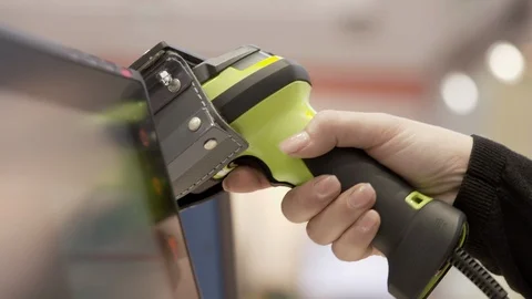 Using a Barcode Scanner at the Cash Register 動画素材 118547847