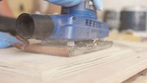 Using belt sander to restore old wooden furniture slow motion Stock Footage 78939691