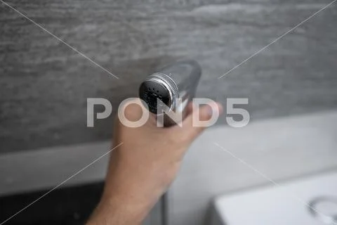 Using of bidet shower in bathroom with a bidet or toiler. Bidet shower in male Stock Photos