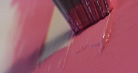 Using bigger brush to do initial painting strokes with pink color paint Stock Footage 126982884