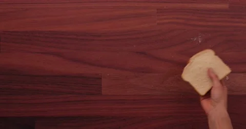 Using bread to clean up glass 2 Stock Footage 132220367