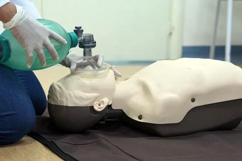Using a Breathing bag (Ambu) by a student on a simulation dummy during BLS Stock Photos