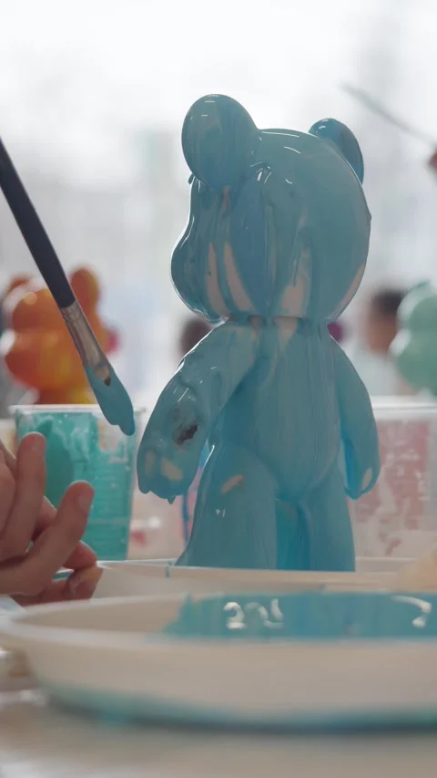 Using a brush, the artist creates an abstract drawing using viscous blue paints Stock Footage 306588907