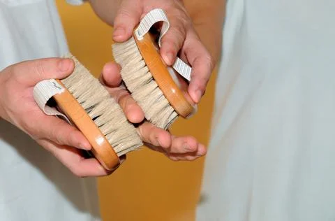 Using brushes at a hand massage Stock Photos