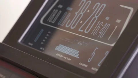 Using built-in fat burning workout program on elliptical trainer for weight loss Video stock 75813206