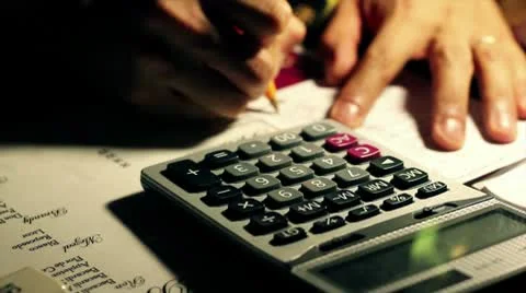 Using Calculator Stock Footage 8975876