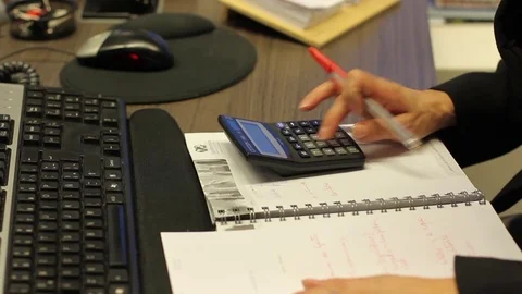 Using calculator Stock Footage 77046955
