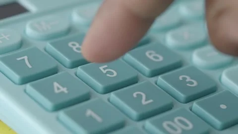 Using a calculator for math calculations and data entry Stock Footage 301460706