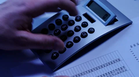 Using calculator, overhead Video stock 61818538