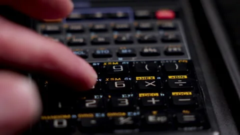 Using calculator solving math problem close up. Using calculator up close. Stock Footage 264061178