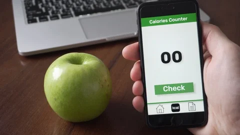 Using calorie counting app on the smartphone to check calories Stock Footage 109404387