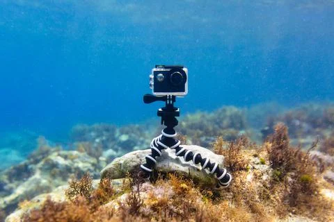 Using camera in waterproof box on a tripod to make photos and video Foto stock