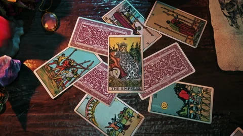 Using a card displaying regal Empress for the medieval times witchcraft ritual Stock Footage 224900833