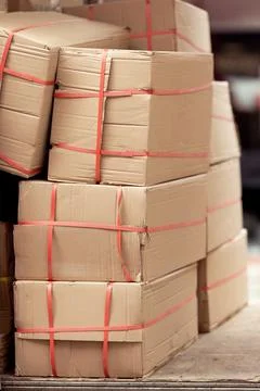Using cardboard for packaging during transportation. Paper boxes. Stock Photos