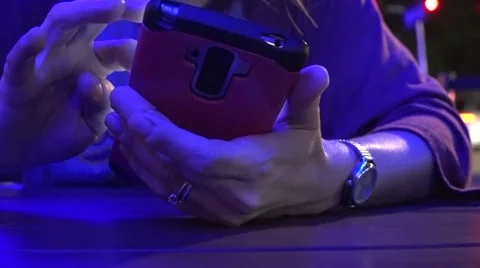 Using Cell Phone In Blue Light Video stock 57340083