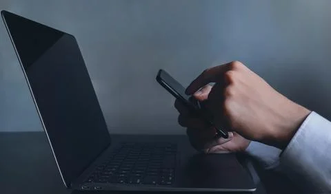 Using cell phone at work closeup concept image Stock Photos