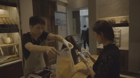 Using cellphone to pay in shop, Shanghai, China. Stock Footage 113895153