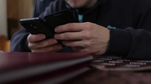 Using cellphone in restaurant Stock Footage 73756288