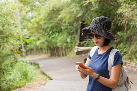 Using cellphone when hiking Stock Photos