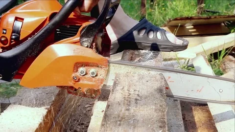 Using chainsaw to cut the mark timber. MS statick shot Video stock 74734425