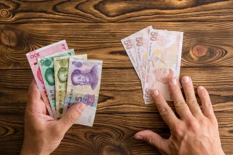 Using Chinese Yuan to pay instead of Turkish lira Stock Photos