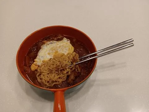 Using chopsticks to eat Stock Photos