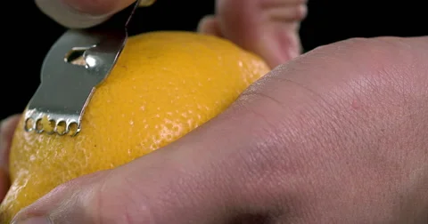 Using citrus zester on a lemon Stock Footage 55880434