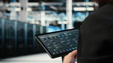 Using coding application, tablet and programmer in data center Stock Footage 330100555