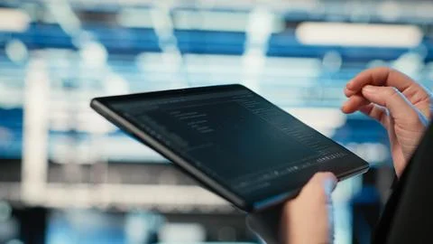 Using coding application, tablet and programmer in data center Stock Photos