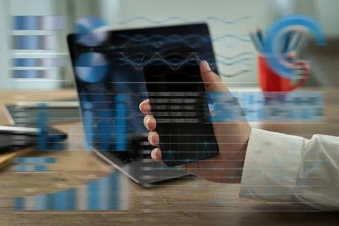 Using a computer, an analysis businessman Working at a home office while st.. Foto stock