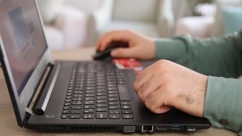 Using computer and payment Stock Footage 109659243