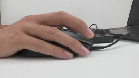 Using Computer Mouse on Desk with Keyboard and Laptop Stock Footage 311795634