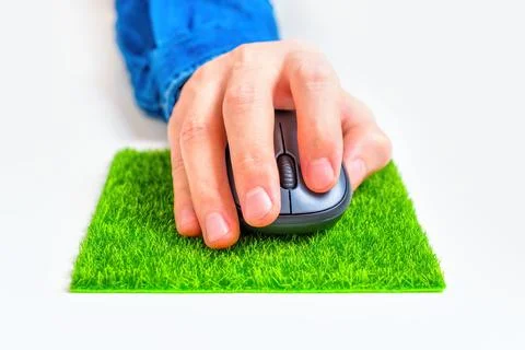 Using Computer Mouse on a Grass Patch Pad Stock Photos