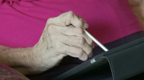 Using Computer Tablet with Arthritis Stock Footage 22796133