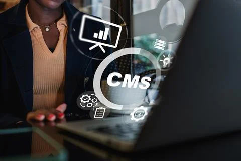 Using a content management system on a laptop for work in a modern office Stock Photos