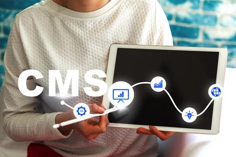 Using a content management system on a tablet for online tasks Stock Photos
