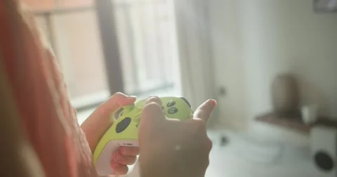 Using controller playing video games - close up of hands and joypad. Close-up Stock Footage 283136161