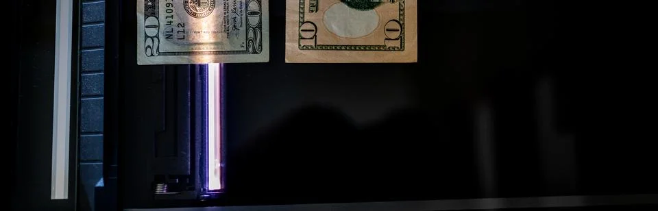 Using a copy machine to print forgery currency. Stock Photos