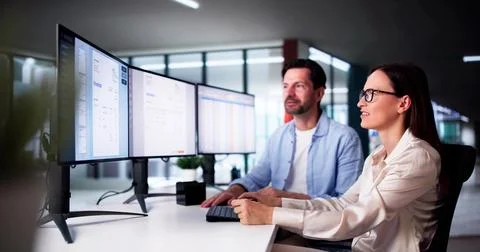 Using Corporate Invoice Spreadsheet On Computer Monitors 写真素材