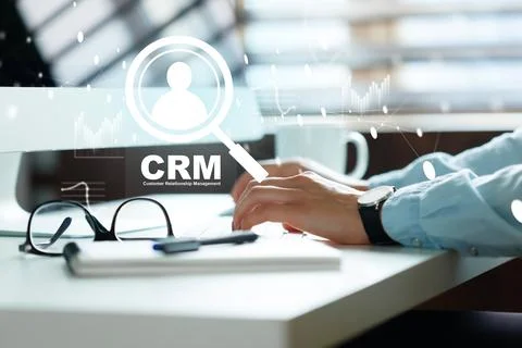 Using CRM software on computer for customer management in a modern office Stock Photos