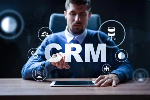 Using CRM software for customer relationship management in an office setting Stock Photos