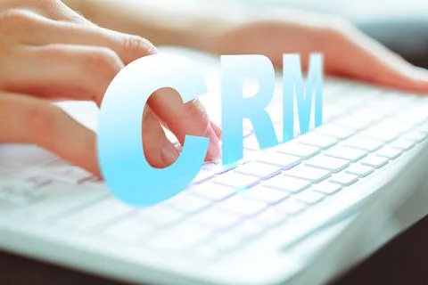 Using CRM software on a keyboard to manage customer data and interactions Stock Photos