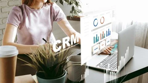 Using CRM software for managing customer relationships at a workspace Stock Photos