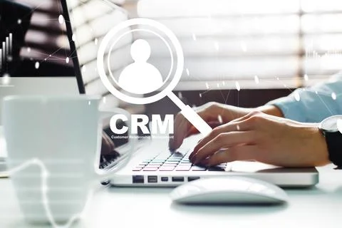 Using CRM software for managing customer relationships in a modern office Stock Photos