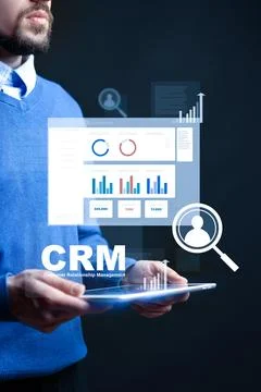 Using CRM tools for data analysis and customer management in a business setting Stock Photos