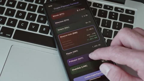 Using cryptocurrency wallet app on smartphone Stock Footage 337998104